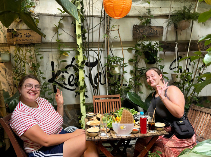 Foreign visitors enjoying a calm vegetarian meal in Ho Chi Minh City.